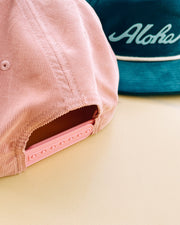 Throwback Hawaii corduroy cap with aloha script felt applique by Nick Kuchar. Available in four colors, one size fits all.