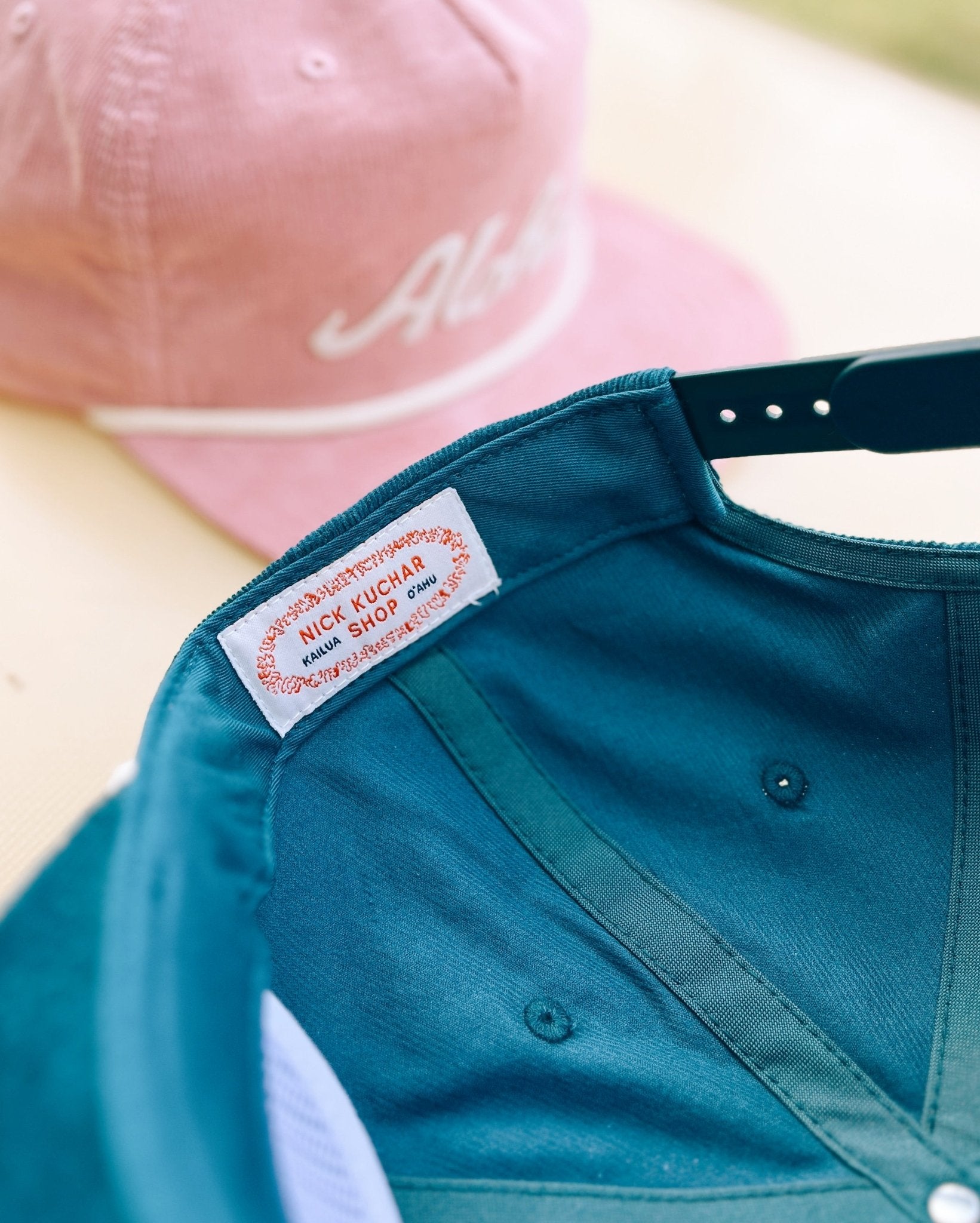 Throwback Hawaii corduroy cap with aloha script felt applique by Nick Kuchar. Available in four colors, one size fits all.