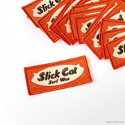 slick cat surf wax orange embroidered patch by Nick Kuchar
