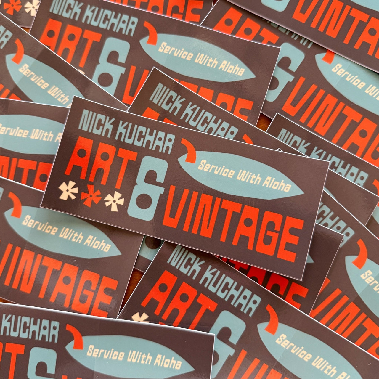 Stack of 'Nick Kuchar Art & Vintage' stickers with colorful text and graphics.