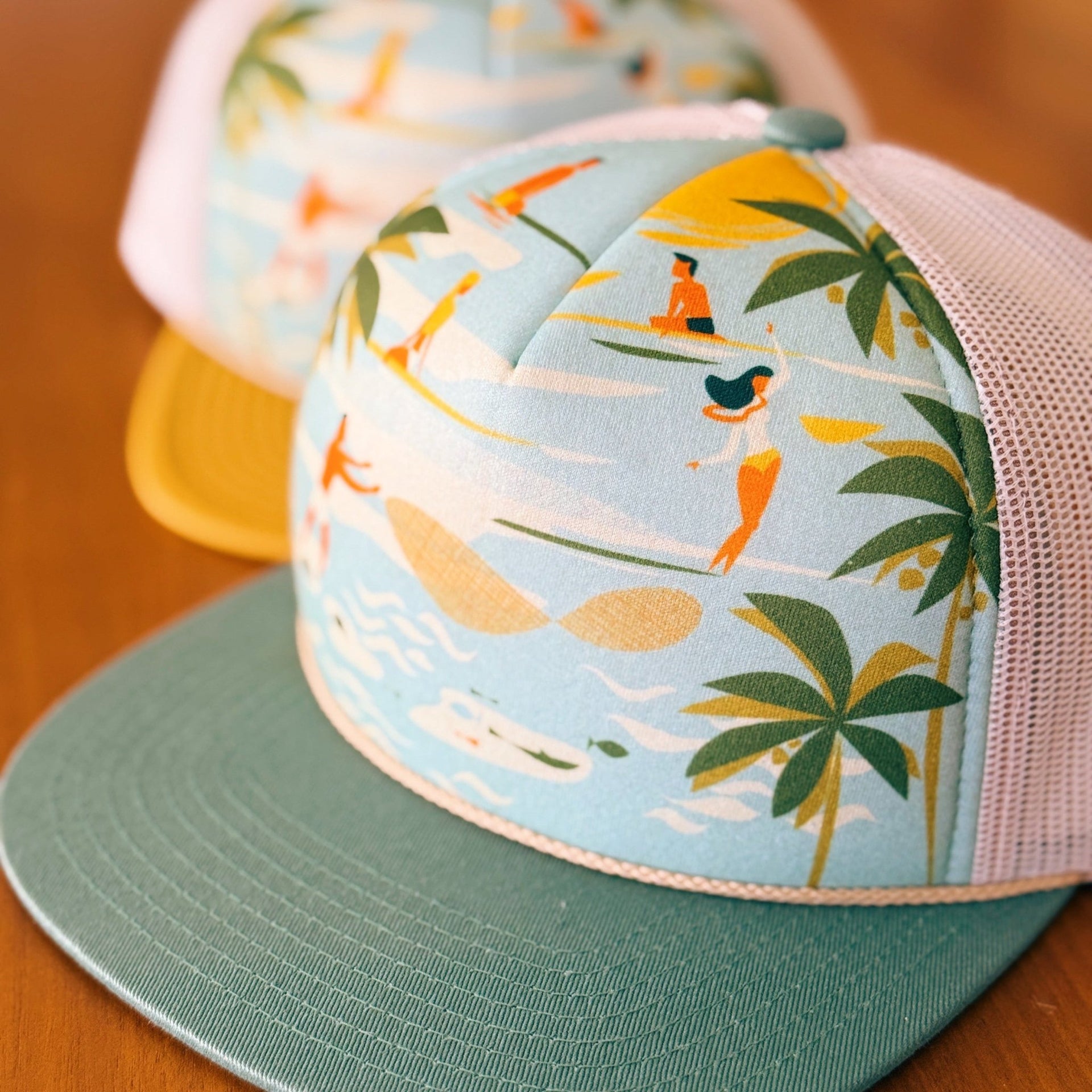 yellow and teal foam trucker hat with surfer and hawaii art