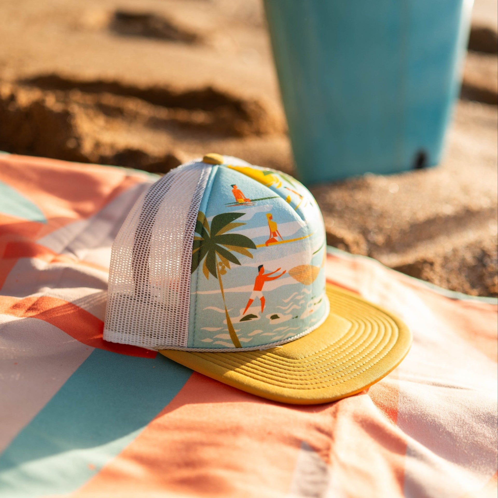 Colorful cap with a tropical design on a striped fabric surface