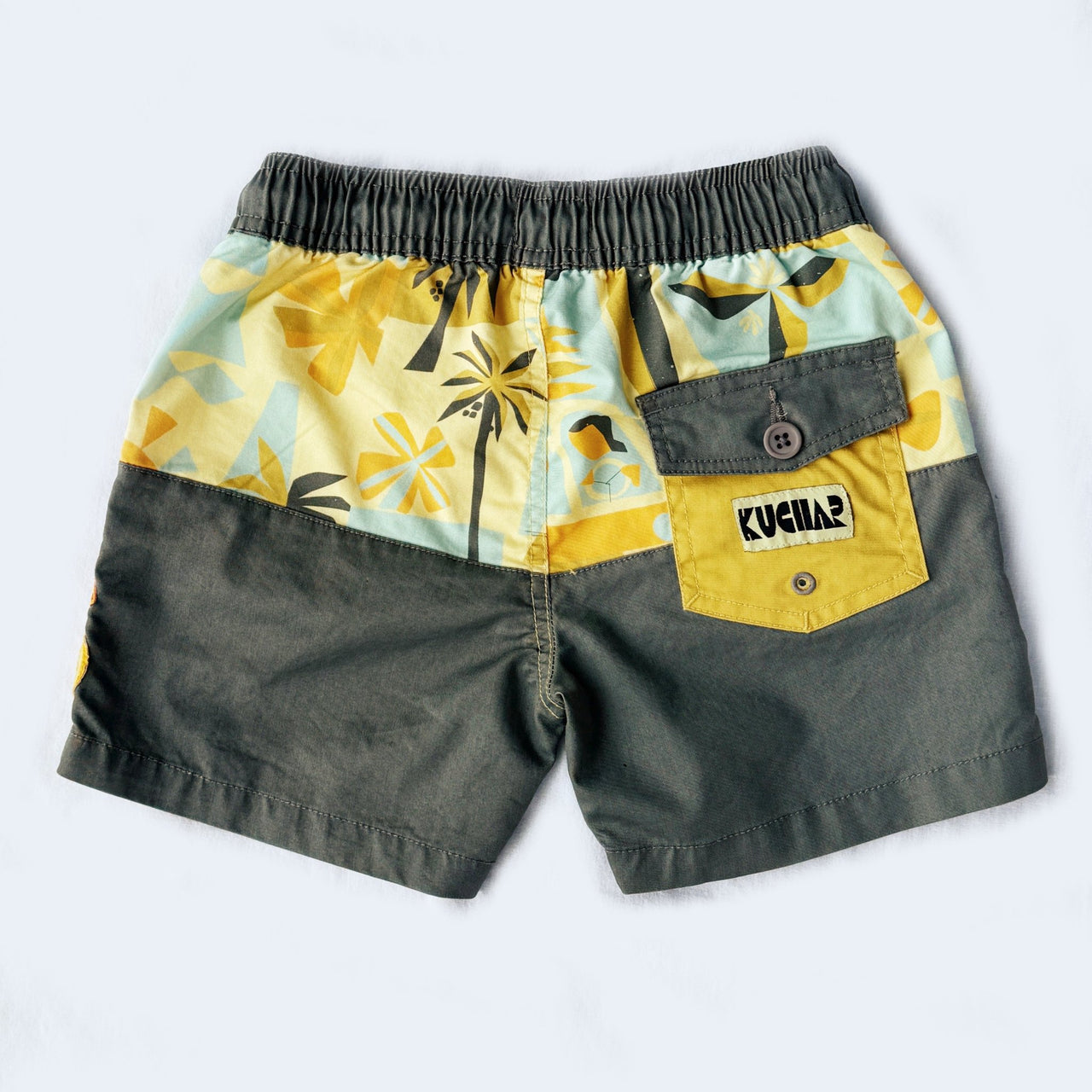 Children's shorts with a yellow and gray pattern on a white background