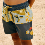 Colorful shorts with a pattern on a sandy background